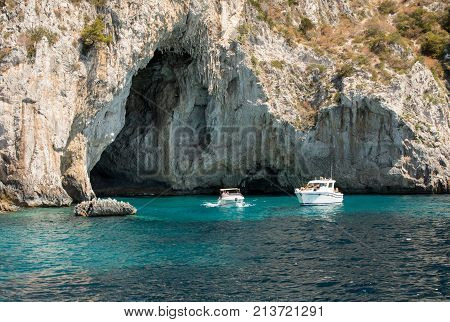 CAPRI ITALY - JUNE 13 2017: Boats with tourists near Grotta Bianca and Grotta Meravigliosa Capri Italy