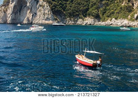CAPRI ITALY - JUNE 13 2017: Boats with tourists near Grotta Bianca and Grotta Meravigliosa Capri iATLY
