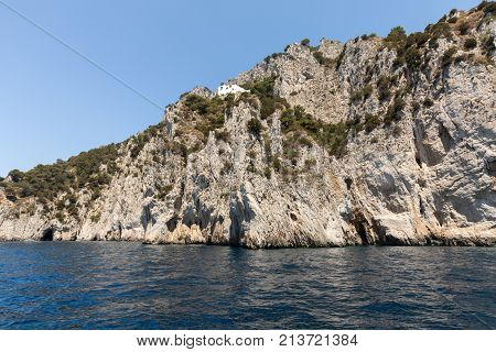 View from the boat on the cliff coast of Capri Island Italy