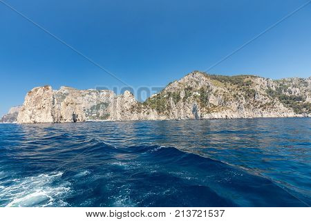 View from the boat on the cliff coast of Capri Island Italy