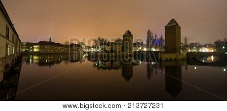 medieval bridge Ponts Couverts and barrage Vauban, night scene of Strasbourg, France