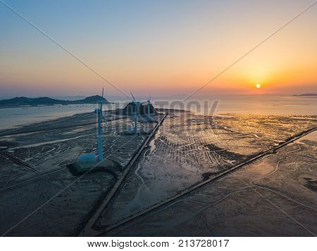 Aerial View Sunset Of Wind Turbine In Daebudo Island,south Korea