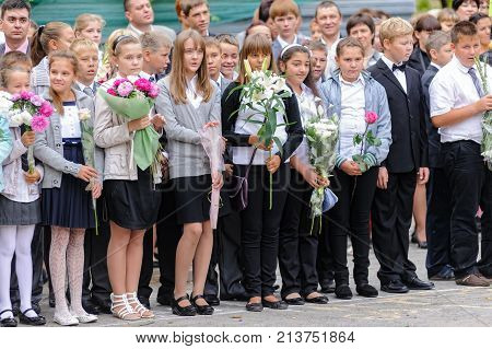 Tyumen, Russia - September 1, 2012: School 43. School line is in schoolyard with pupils and teachers. Feast Day of Knowledge.