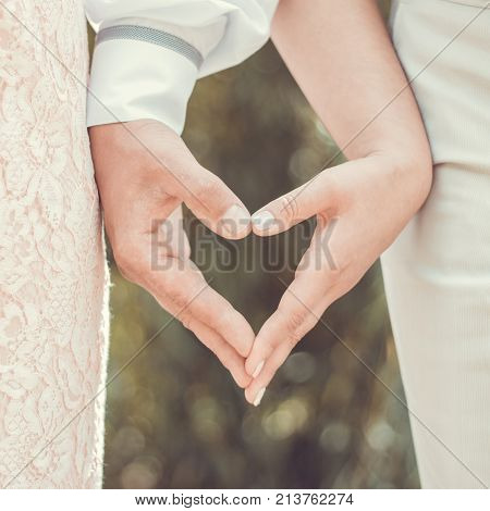 Wedding heart from the hands of the newlyweds
