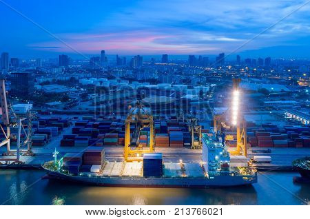 Containers yard in port congestion with ship vessels are loading and discharging operations of the transhipments in international port.
