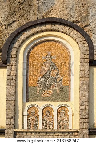 MONTENEGRO, DANILOVGRAD - AUGUST 10, 2017: Mosaic icon on the facade of male Ostrog monastery landmark
