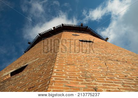 Close Up Faceted Tower Of Kremlin On Blue Sky Background Sunny Summer Day Bottom View. Kolomna Moscow Region.