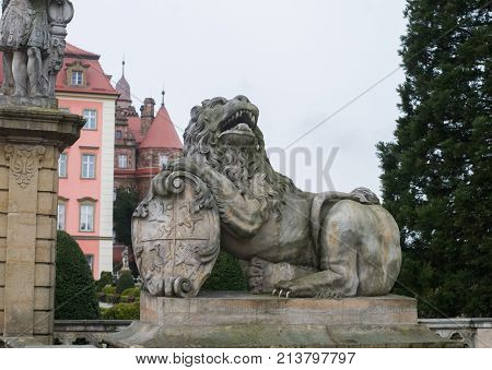 Rock lion statue on the park in Ksiaz Castle