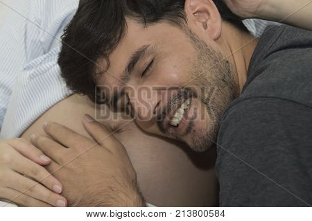 The man and pregnant woman are doing home activities.