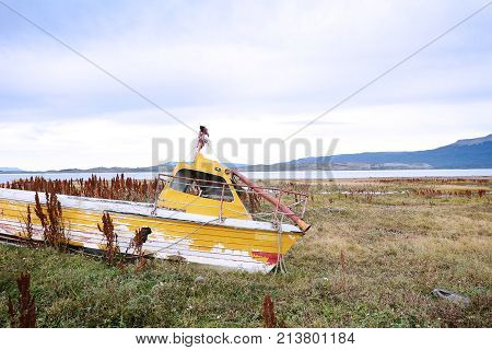 View of old wooden boat abandoned ashore.
