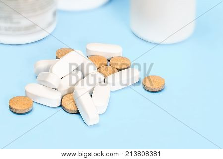 medications.medical tablets and bottles on a blue background