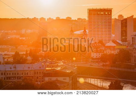 Vilnius, Lithuania. Sunset Sunrise Dawn Over Cityscape. Church Of St Raphael The Archangel And Former Jesuit Monastery. Business District New City Centre Shnipishkes