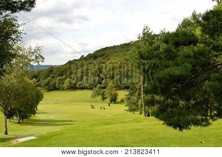 Glossop Derbyshire England UK Europe - August 24 2014 : People playing golf on Glossop golf course in the Peak District national park