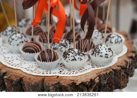 Chocolate Balls Cakepops with Orange Bow on