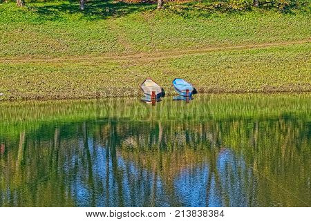 Reflection on the surface of the Kupa river on a beautiful sunny day in Sisak Croatia.