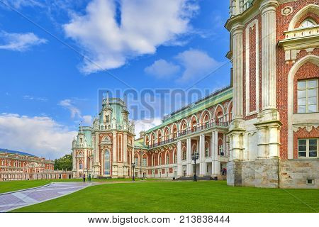 Summer view on Moscow Tsaritsino palace castle and city park. Classic antique european red brick castle architecture. Ekaterina manor house. Vacations tours to Moscow museum and sightseeing places