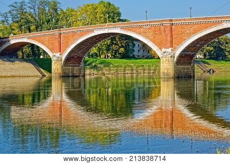 Old bridge on river Kupa on a beautiful sunny day in Sisak Croatia.