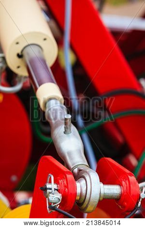 Agriculture equipment concept. Industrial detailed pneumatic hydraulic machinery made of steel closeup
