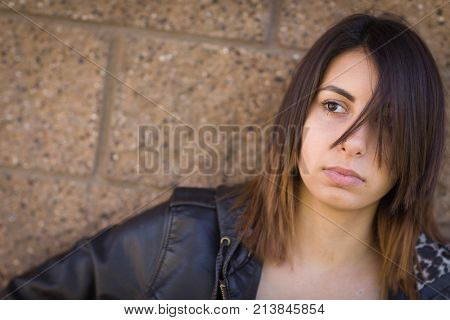 Beautiful Meloncholy Mixed Race Young Woman Portrait Outside.