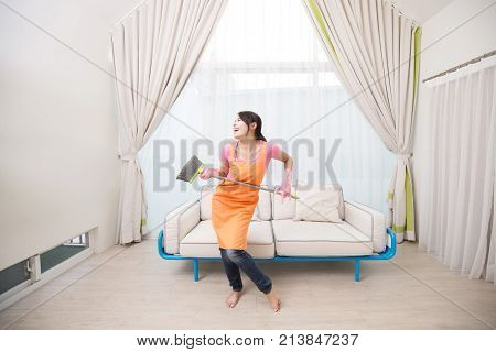 woman smile happily and sing in the living room