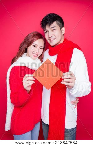 couple show couplets with chinese new year on red background