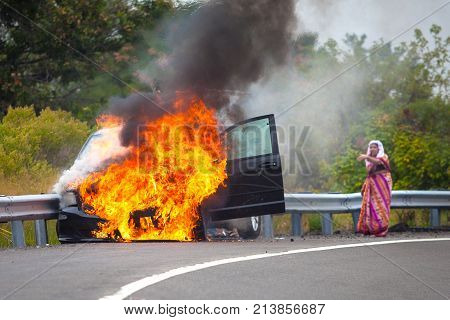 Car On Fire With Passengers