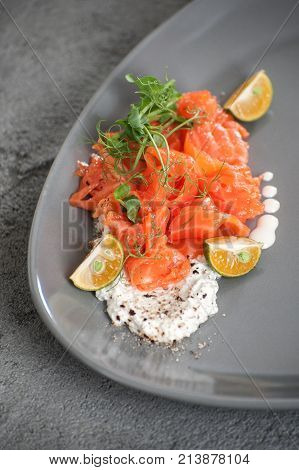 Salad From Slightly Salted Salmon With Cottage Cheese Cream And Limequat..