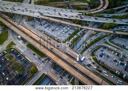 Looking Down At Highways And Traffic During Morning Rush Hour , Aerial Drone View Above Downtown Hou