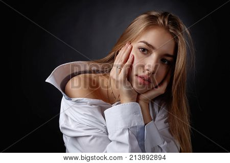 Young Pretty Woman In White Shirt
