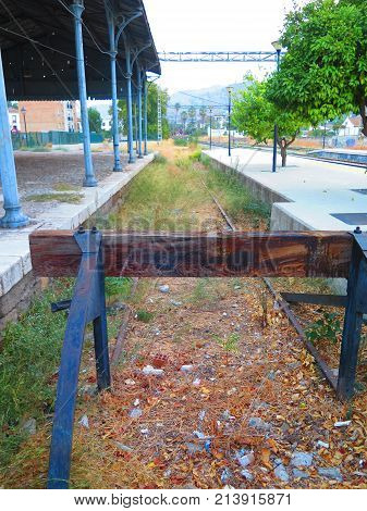 Old wood and steel buffer at end of railway spur