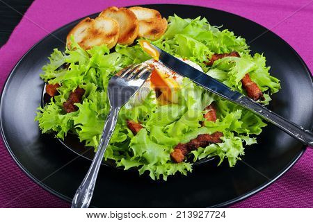 Frisee, Crispy Bacon And A Poached Egg Salad