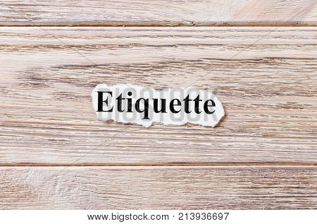 etiquette of the word on paper. concept. Words of etiquette on a wooden background.