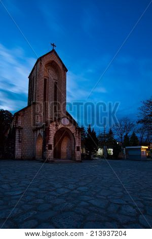 ancient stone church of sapa with blue night sky most popular traveling destination in sapa norhtern of vietnam