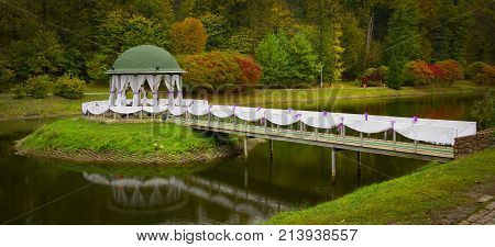 Gazebo in the park surrounded by fall foliage at autumn, Feofania