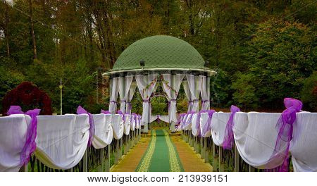 Gazebo in the park surrounded by fall foliage at autumn, Feofania