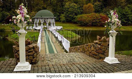 Gazebo in the park surrounded by fall foliage at autumn, Feofania