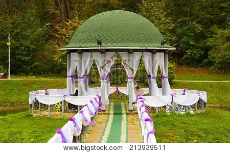 Gazebo in the park surrounded by fall foliage at autumn, Feofania