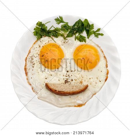 Eggs parsley (vegetables/bread/ketchup) is formed by a funny face on a white plate. The concept of food for children