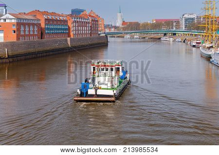 The river tugboat along the river Weser in the city of Bremen.
