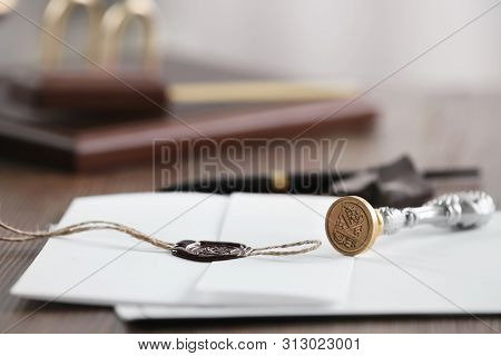 Vintage Notary Stamp And Documents On Wooden Table, Closeup. Space For Text