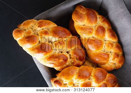Homemade Food Concept Fresh Baked Bread Braid Challah Dough In Bread Basket With Copy Space