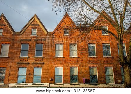 London, Uk -  Feb 13, 2019 : Beautiful Brown Stone Townhouse With Glass Doors In The Chiswick Area. 