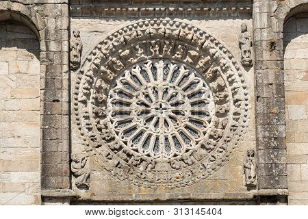 Gothic Style Rosette Made Of Stone And Glass. Antique Church Of Noia, Galicia, Spain