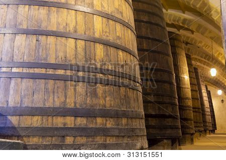 Vintage Wine Cellar With Old Oak Barrels, Production Of Fortified Dry Or Sweet Marsala Wine In Marsa