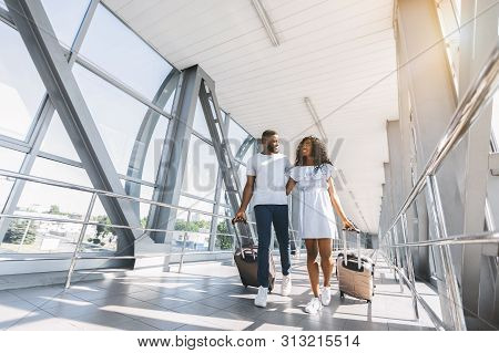 On Way To Honeymoon. African-american Couple Travelers With Suitcases At Airport, Freee Space