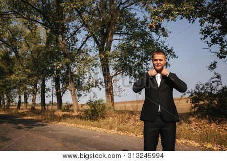 Handsome Groomm Dressed A Tie Bow. Wedding Day. Man Outside. Young Man Smile