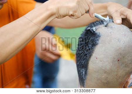 Closeup Shot Of Shaved Hair For Ordained Buddhist Man. Ordain Into Monkhood, Thailand
