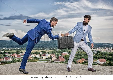 Business Deal Landscape Background. Businessman Takes Away Briefcase From Business Partner. Fraud An