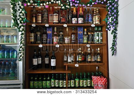 Wonsan, North Korea - May 2, 2019: Wine Shop. Showcase With Various Alcohol Bottles, Imported And Lo