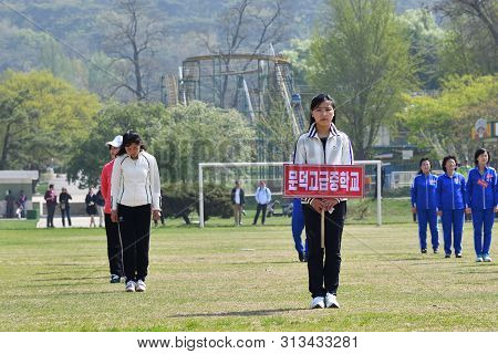 Pyongyang, North Korea - May 1, 2019: Girls Workers  Of Local Factories Gather To Celebrate May 1st 